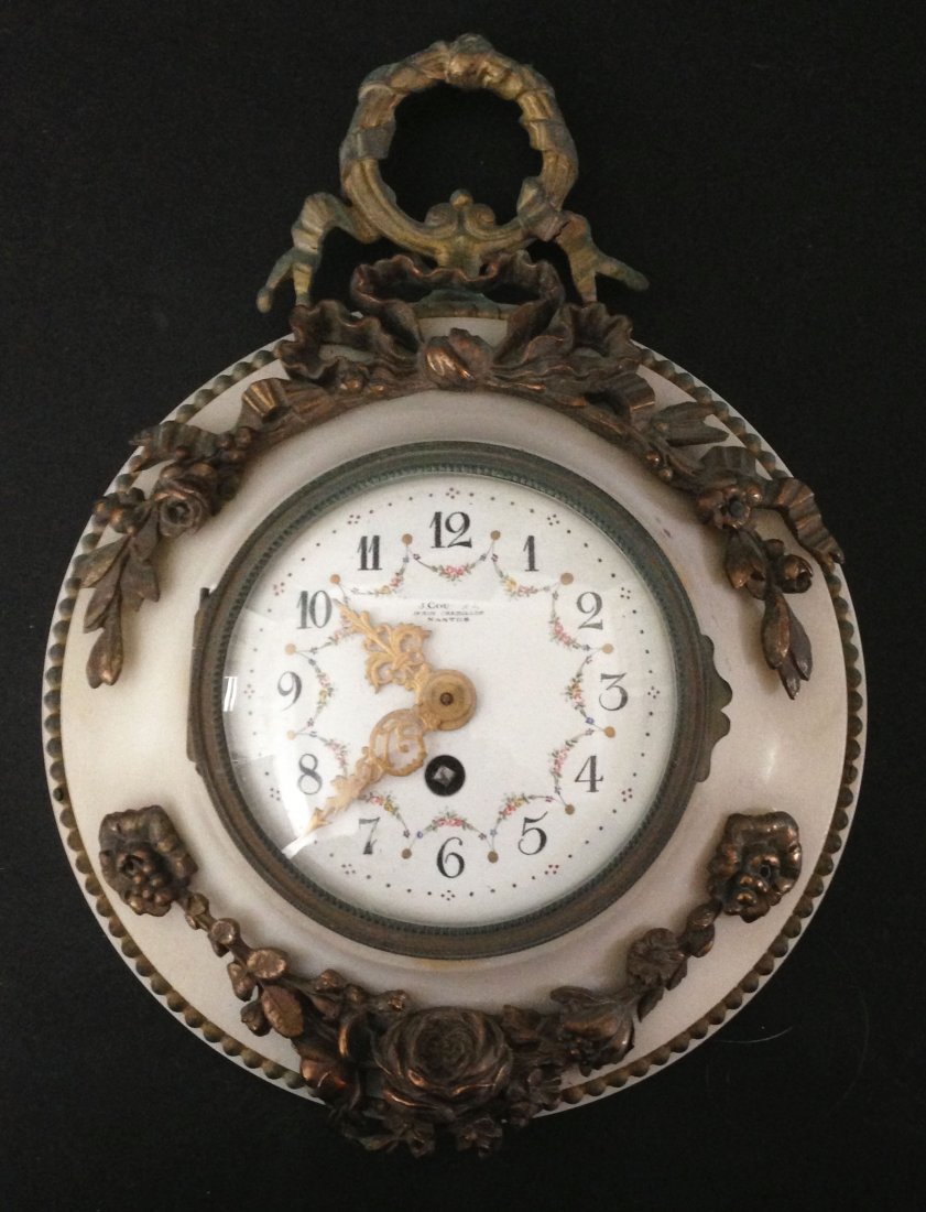 Gilt Bronze & Marble Ormolu French Clock: Dial marked J. Counsin 14 Rue Crebillon Nantes. Measures 6.5" daimeter with a 3" diameter face.