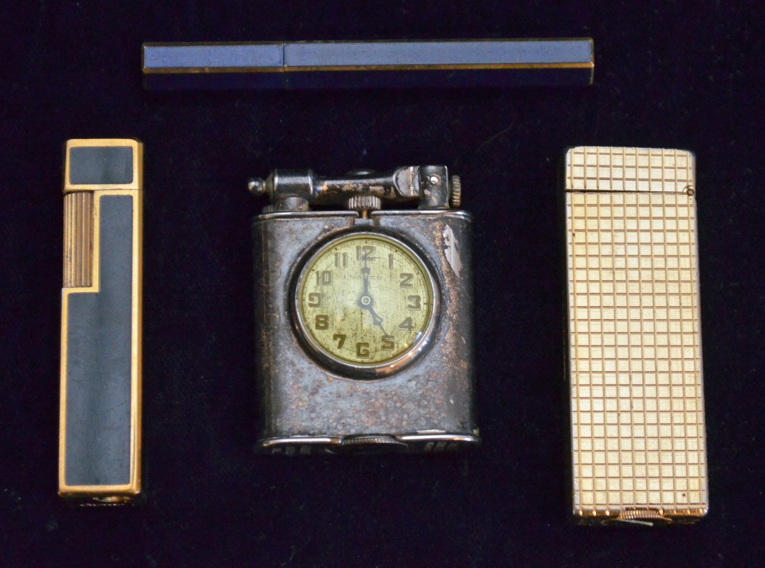 Collection of 4 Vintage Designer Lighters: Lot includes: Cartier Art Deco (2 3/8" l x .5" square), Dunhill Rollalite (2.5"l x 7/8" wide x .5" deep), 6 sided enameled stick lighter (3 1/8" l x 3/8" across bottom), and a Nasco lighter with a wat