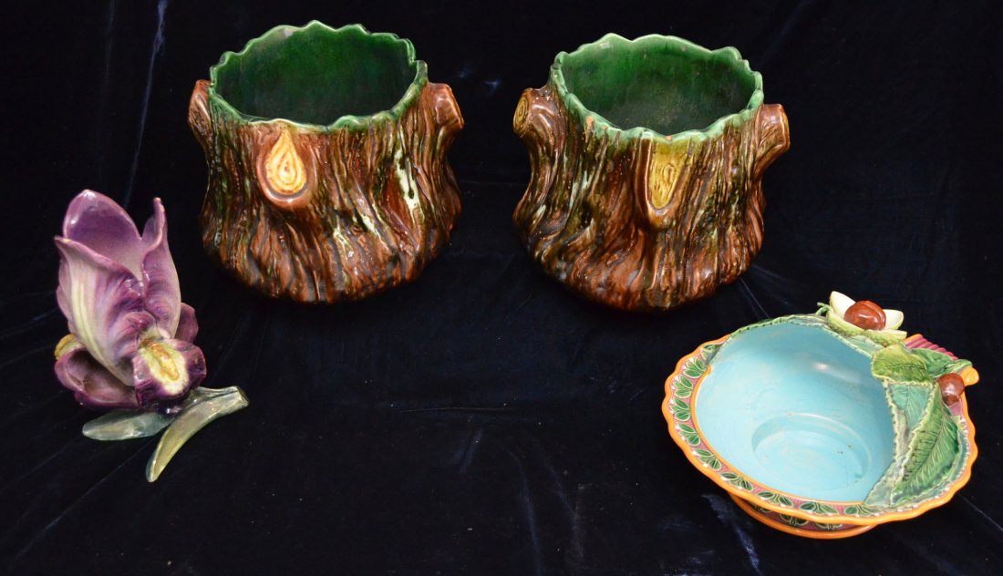 Majolica Lot Including Minton Chestnut, Massier Iris: Nice lot of Majolica including: Minton chestnut serving dish (6'' x 10 1/2"), 2 tree stump planters (7" tall x 8" across top), and an attributed Massier Iris flower (8 7/8" tall).