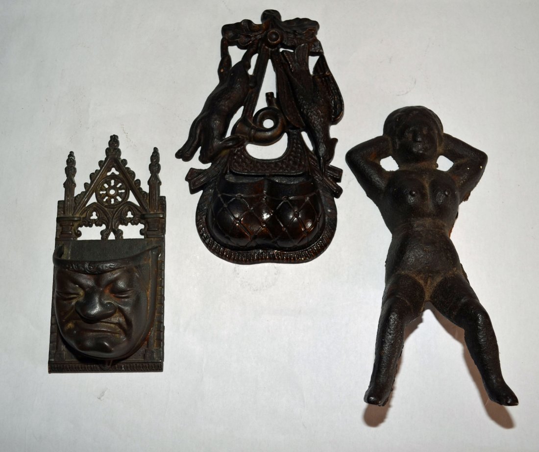 2 Match Safes & a Boot Jack: Lot includes a Quasimodo match safe (7.5" t x 3.5"w), Hunt match safe (8.75" x 5.5", repaired, seen on back-side), and nude woman boot jack (9.75"l x 4.5" wide).
