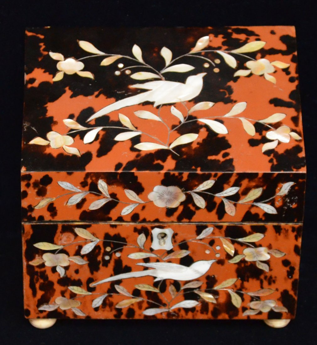 Tortoise Shell & Mother of Pearl Inlaid Tea Caddy: Features inlaid floral/foliate motif with a bird. Measures 5.5" tall x 6" long x 4" wide.