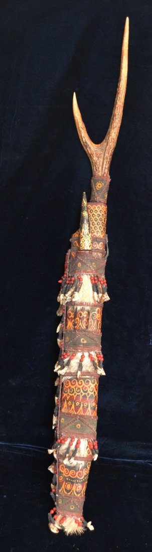 African Machete Sword in Wooden Sheath: The blade of the sword measures 18 5/8" (L) x 1 3/4" (W). The horn handle measures 12.5" (L). The case measures 22.5"(L). In estate found condition.