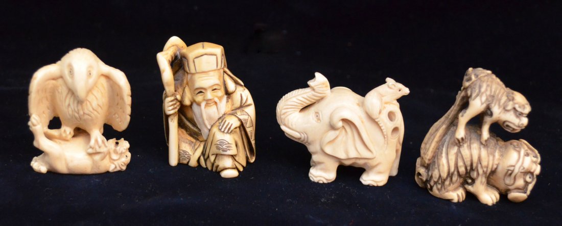 4 Vintage Signed Ivory Netsukes: Lot includes4 Netsukes, all artist signed: 2 foo dog/lion netsuke (1.75" tall), elephant with mouse (1 3/8" tall), wise man (1 5/8" tall), and an eagle on a foo dog (1 5/8" tall).