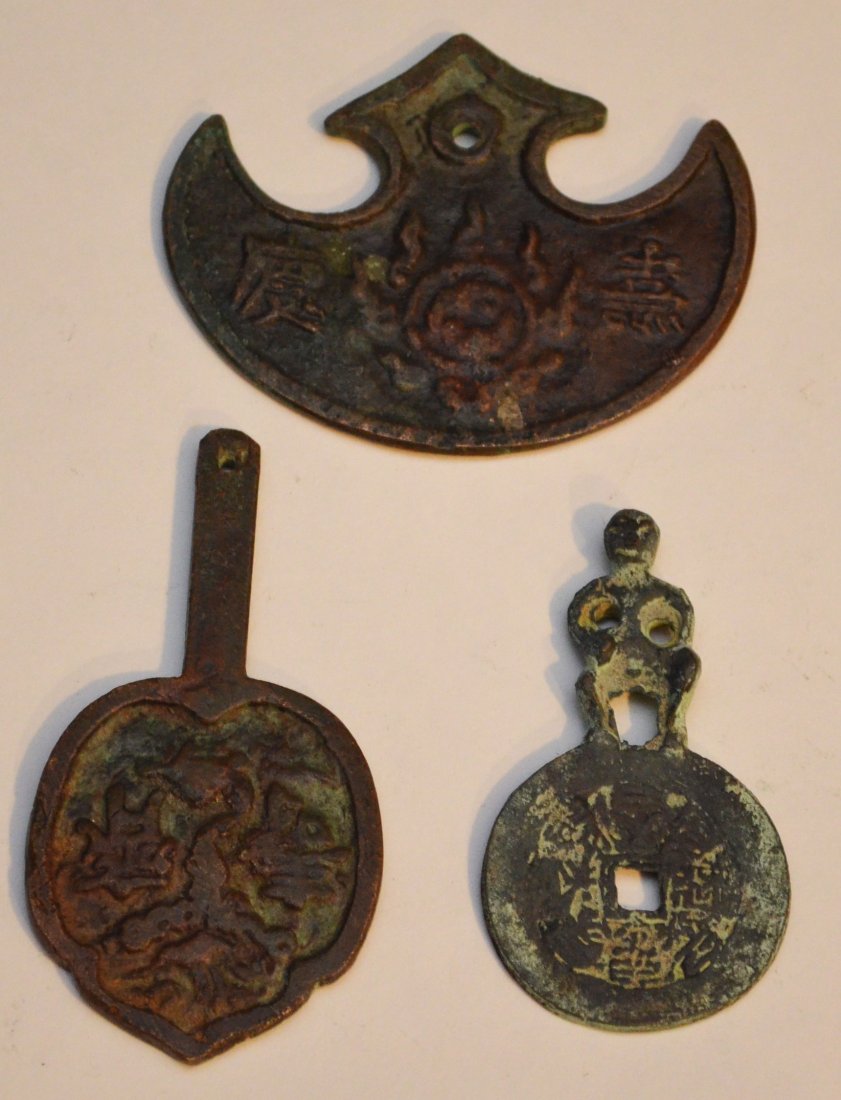 Ancient Chinese Bronze Money: Lot includes: Annam Devil Coin (2.75" long), Mirror money (3.75" long) and moon money (3.25" long).