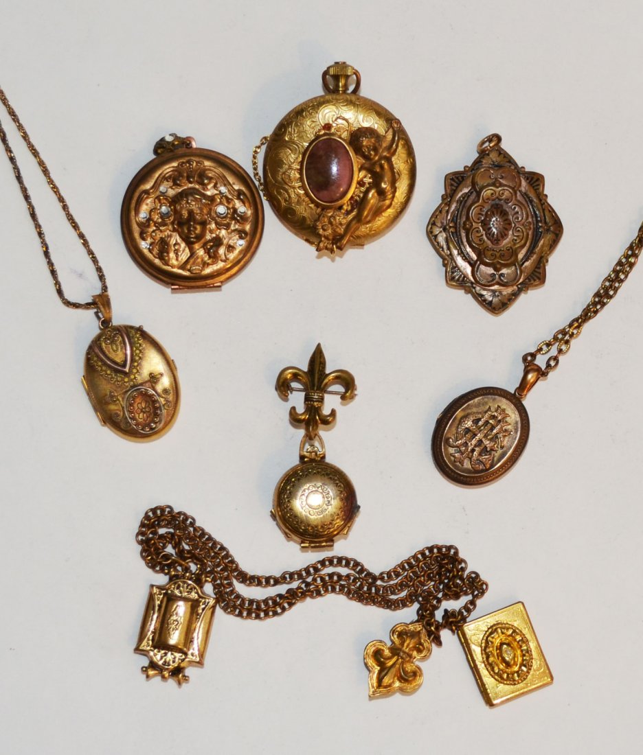 Lot of Vintage & Antique Lockets: Includes: pocket watch style (2.25"), Art Nouveau woman (2"), Victorian oblong star shaped (2" x 1.5"), one with a wishbone on a chain (1.75" x 1", chain 15.25"), monogrammed on chain(1.5" x 1", chain