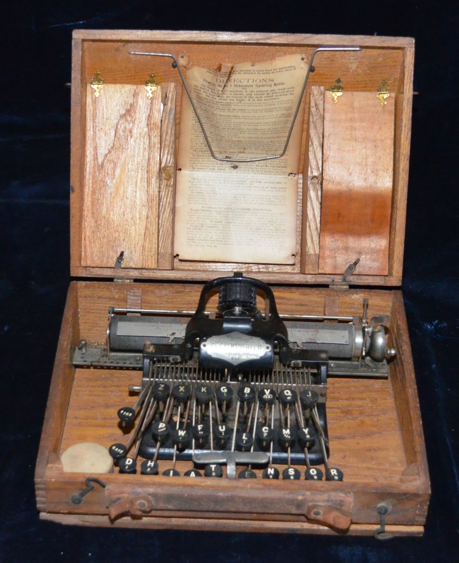 Blickensdorfer Typewriter in Wooden Case: Blickensdorfer No 5 typewriter in original box with instructions, was introduced in 1893 at the World's Columbian Expedition. Measures 6.5" tall x 9.25" deep x 12.75" long.