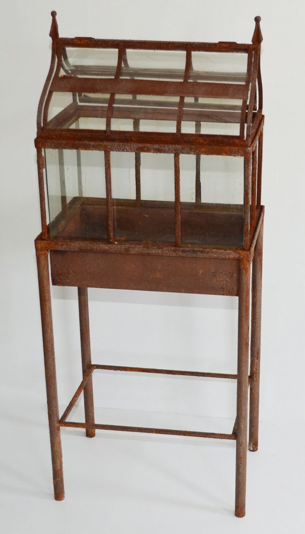 Antique Iron & Glass Terrarium: It measures 37" tall x 13" wide x 19" long.