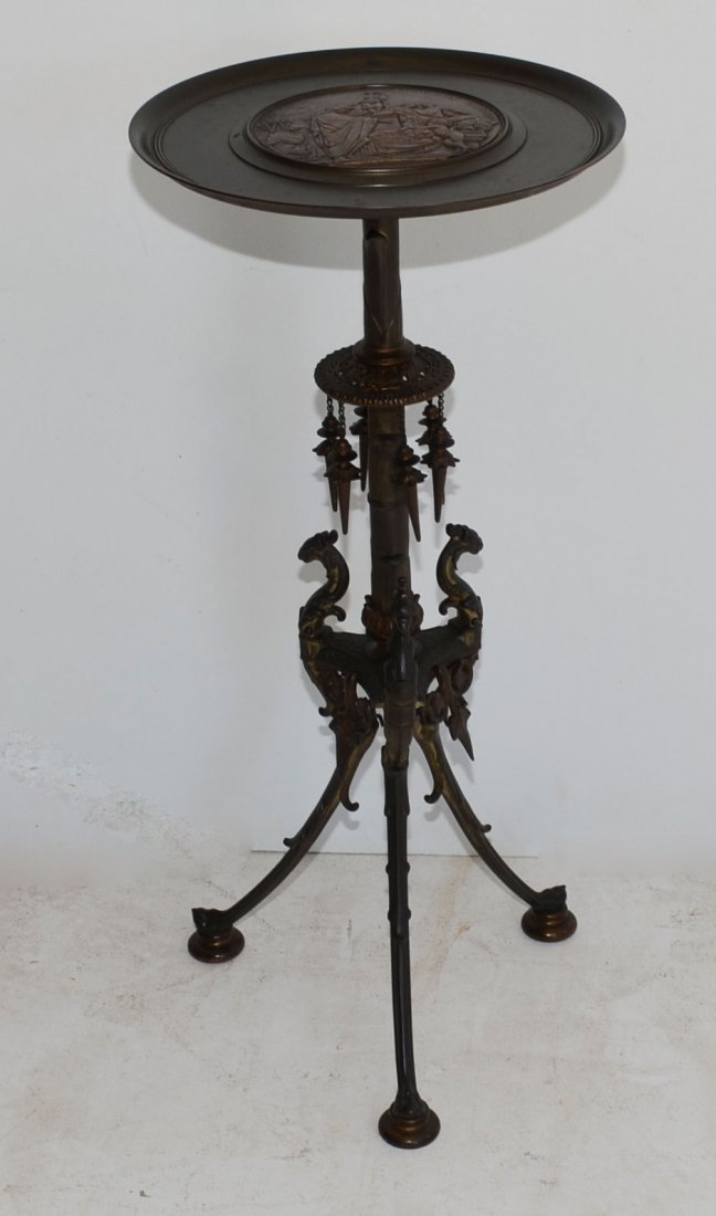 High Style Neoclassical Victorian Bronze Table: Aesthetic movement. Center plaque reads "E. PICAULT OLYMPIAS XCI GRAECI SYRACUSIS CAPTIVIT Exp Des Arts 1863 (date cut off)". The base features griffin legs and bamboo/papyrus like pole. Measures 31.7