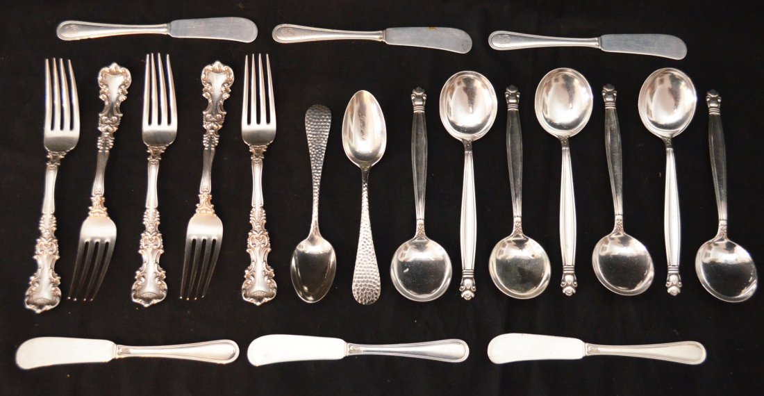 Lot Of Misc Sterling Silver Flatware: Lot includes: 6 Gorham pate knives (5.5"), 5 International Avalon (6.75"), 7 Weidlich Jenny Lind soup spoons (6 1/8"), and 2 hand hammered style spoons (5 5/8"). Gross weight is 22.34ozt.