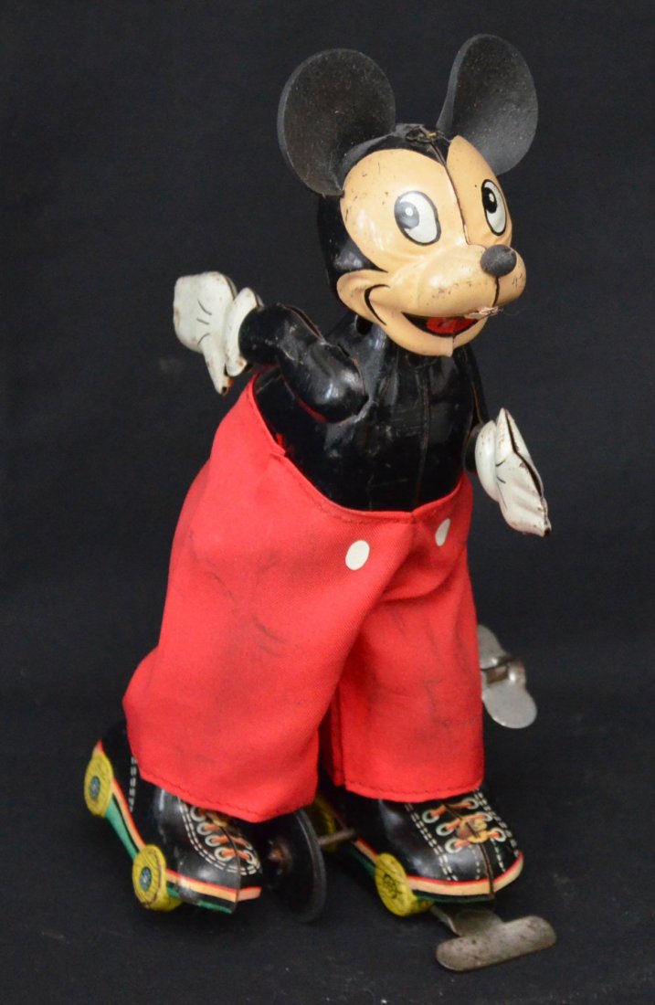 Mickey Mouse Tin Roller Skater Toy: Measures 6" tall x 4.5" long x 2.5" wide at base.
