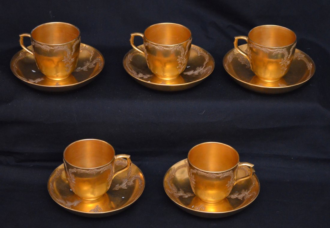 KPM Berlin Scepter Mark Porcelain Cups & Saucers: Mat Healy? Trade mark gold painted on Berlin scepter mark cups & saucers. Lot includes 5 cups (2.5" tall x 2.5" diameter at the top) and 6 saucers (1" tall x 5" diameter).