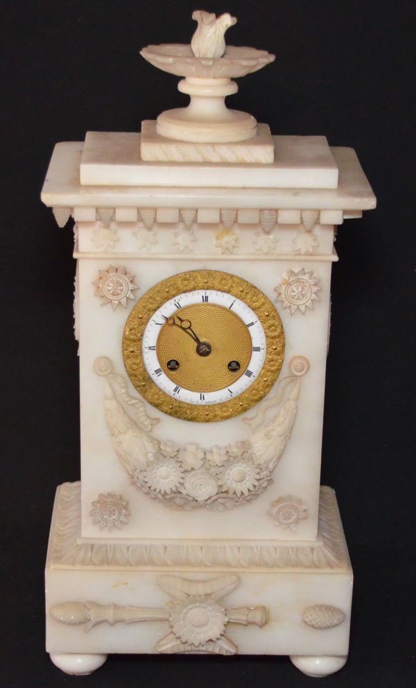 Carved Empire Alabaster Clock: Ornately carved Empire style alabaster clock with gilt d'ore face. The clock measures 15.5"T x 7"W x 5"D