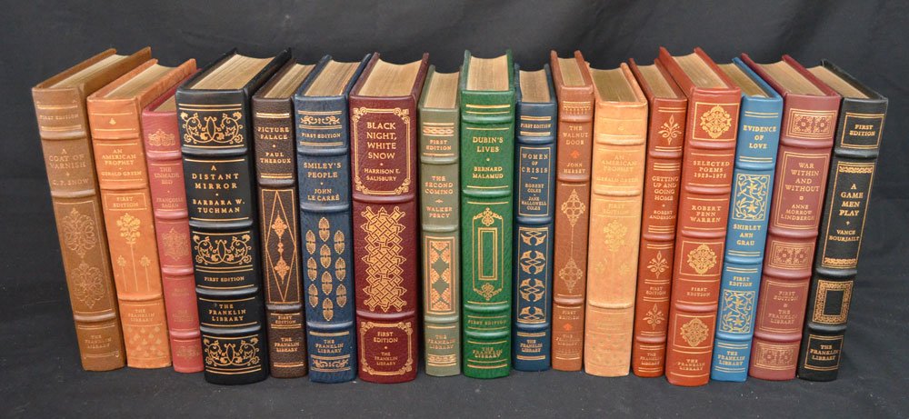18 First Edition Franklin Library Books: Lot of leather bound books. The Walnut Door By John Hersey, (2) An American Prophet By Gerald Green, Picture Palace By Paul Theroux, Smiley's People By John Le Carre, Getting Up And Going Home By Robe