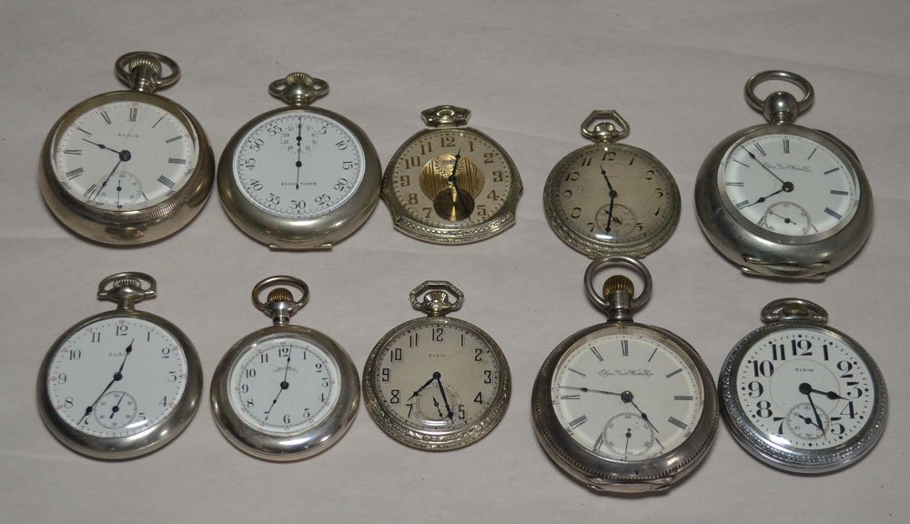 Lot of 8 Elgin Pocket Watches: Lot Includes: Elgin Timer (2"), Elgin (1.75"), Elgin (2"), Elgin (1.75"), Elgin (2.25"), Elgin w/chain (1.75"), Elgin (2"), Elgin (1.75"), Elgin Nat'l Watch Co. (2.25"), Elgin Nat'l Watch Co. (2.25)