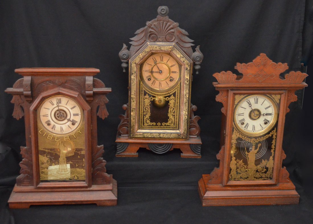 3 Antique Gingerbread Style Clocks (Ingraham, Welch): Lot includes: Ingraham Statue of Liberty clock (18.75" tall x 14.25" l x 5" d), Welch 8 day Linda clock (21"t x 13.5"l x 4 5/8"d), and clock with faux painted marble trim (22"t x 12.5"l x 4"d).