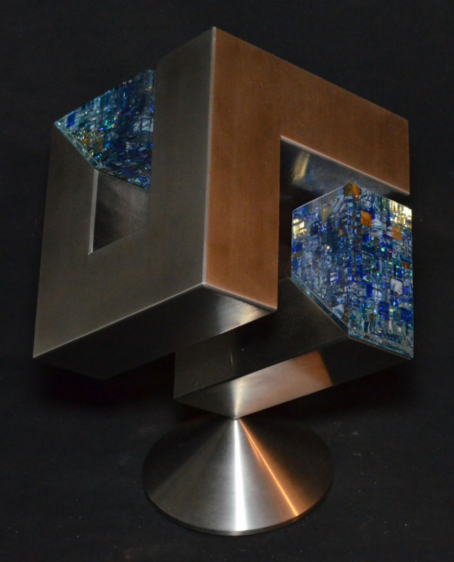Revolving Glass Sculpture by Artist Jon Kuhn: Jon Kuhn Laminated and Polished Glass and Stainless Steel Sculpture Titled "New York Blues" of open cube form, with L-form and U-form sides, inset with two rectangular prismatic elements, on a rotatin