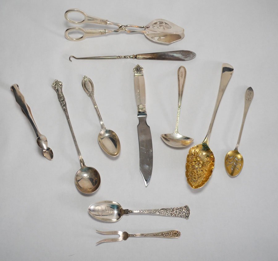 Lot Of 11 Misc Sterling Silver Serving Pieces: Lot includes: Georg Jensen sterling handle knife (8"), Steiff pickle fork (4.75"), sterling handle asparagus server (8"), repousse style "Omaha" spoon (5 7/8"), Simpson Hall & Miller long handle spoon