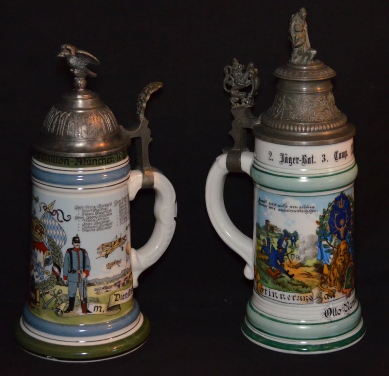 2 German Regimental Beer Steins w Lithophane Scene: One stein features a lithophane portrait of an officer and has the name Otto Ramke on the front. The lid features 2 soldiers, while there are 2 dates of 1900/1902 (11.25" tall x 4.25" diameter at the 