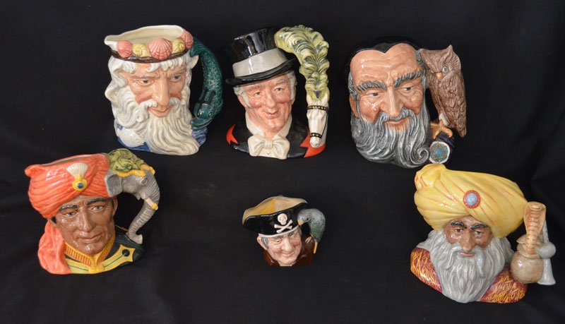 Lot of 6 Royal Doulton Character Toby Mugs: Lot includes: The Snake Charmer, The Elephant Trainer, Long John Silver, Merlin, Ring Master and Neptune. They range from 4" to 7.25" tall.
