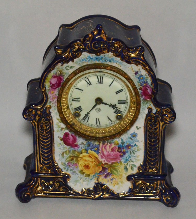 Ansonia Painted Royal Bonn La Mosella Porcelain Clock: Deep blue / cobalt. Measures 12.75" tall x 11" wide x 5.25"ndepp