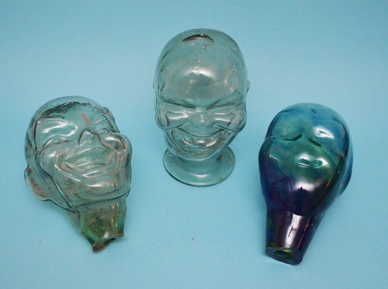 3 Larry Livolsi Art Glass "Fred" Heads: Vary in height from 9.5" to 10.5" tall. In estate found condition. One of the clear heads has a chip on top.