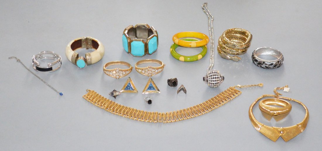 20 Piece Lot of Cotume Jewelry: Lot includes: Monet gold collar necklace and bracelet, faux truquoise Cara bracelet, enamel cuff, snake bracelet, 2 Rhinestone bracelets, Indian bone cuff, enamel link bracelet by Monet, Danbury Bowli