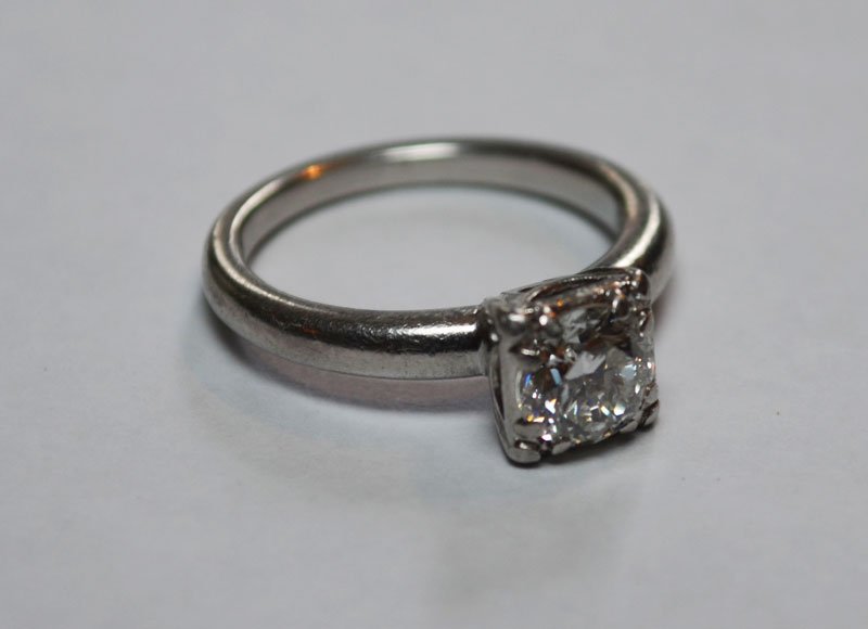 Platinum & 3/4 C Diamond Solitaire: Center brilliant cut 3/4 c diamond G-H, SI. Weighs 3.7 DWT