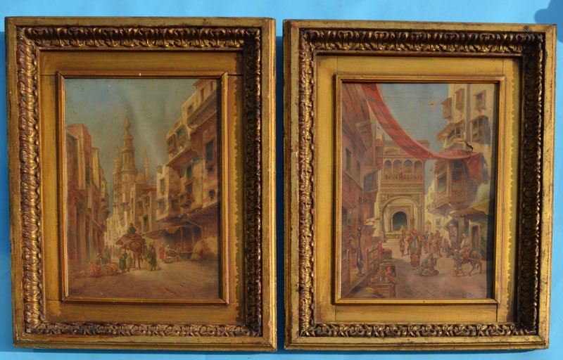 Pair of Early Middle Eastern Bazaar Paintings: Frames: 28" x 21" / Images: 18.5" x 12.25". In estate found condition. Canvases need to be restretched. One has rips and tears to the canvas. Both have some staining and missing paint.
