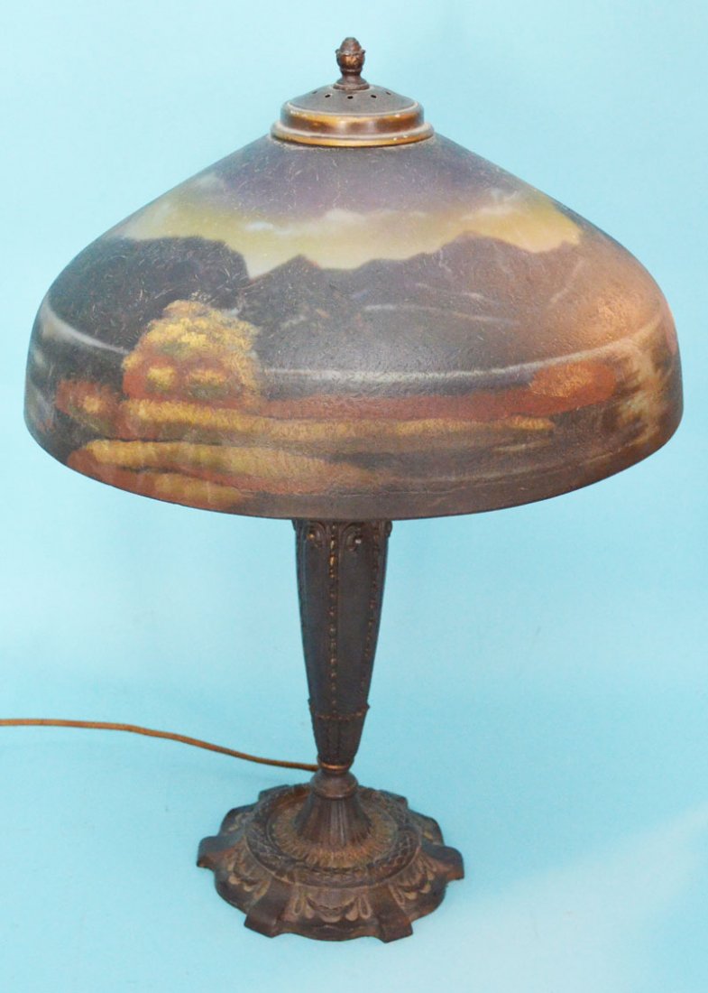 Pittsburgh 9 Lakes of Killarney Painted Glass Lamp: Measures 22.75" tall x 16" diameter of lamp shade. In very nice overall condition. There is some residue of label of maker as shown in photographs. The cord does need to be replaced.