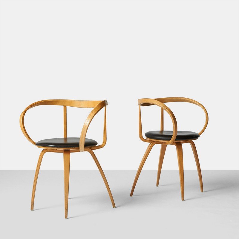 George Nelson, Pair of Pretzel Chairs: A pair of laminated "Pretzel" chairs #5890 by George Nelson, designed for Herman Miller.United States, c1980Width : 26" Depth : 19" Height : 30.5"Steam Bent Birch, Leather