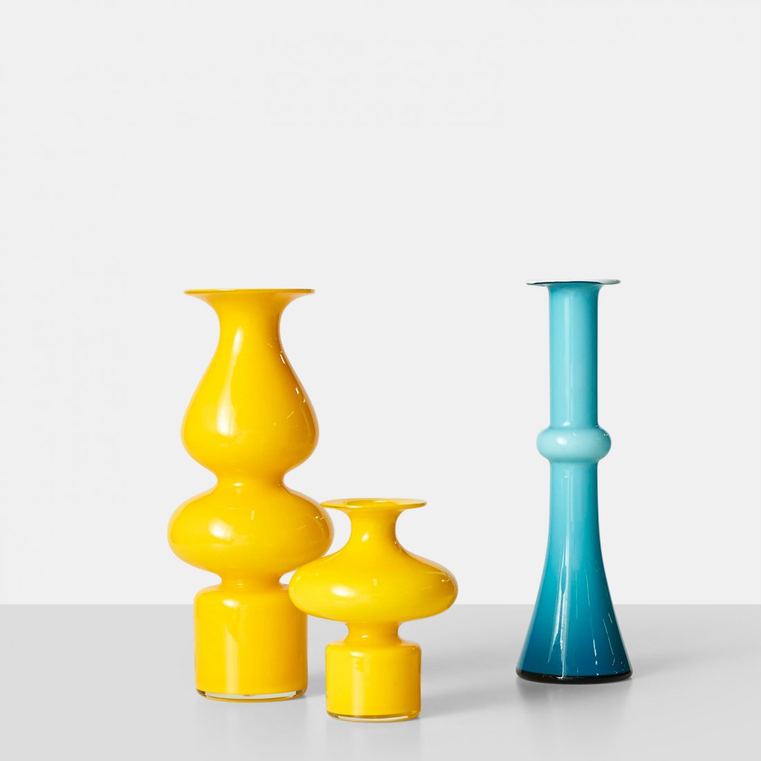 Michael Bang, Set of 3 Carnaby Vases: A grouping of Carnaby vases by Michael Bang. The vases are made of yellow and blue opaline glass with like color interior. Produced by Holmegaard.Denmark, c1960sDiameter : 5.75" Height : 6"