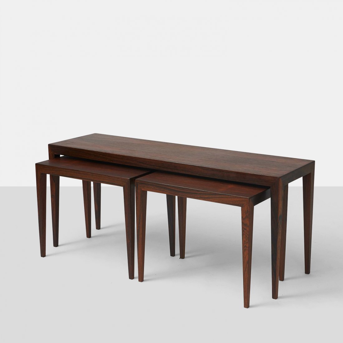 Severin Hansen Jr, Nested Coffee and End Tables: A set of Severin Hansen Jr. nesting coffee and end tables. For Haslev Mobelsnederski, in Brazilian rosewood.Denmark, c1960sWidth : 43.25" Depth : 12.5" Height : 20"Rosewood