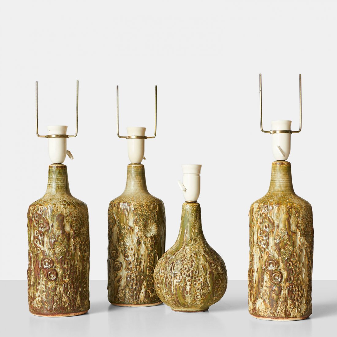 Jorgen Mogensen, Collection of Table Lamps: A set of 4 stoneware table lamps by Jorgen Mogensen.Denmark, c1960s Diameter : 5" Height : 15.25" (Without Harps)Stoneware, Wiring