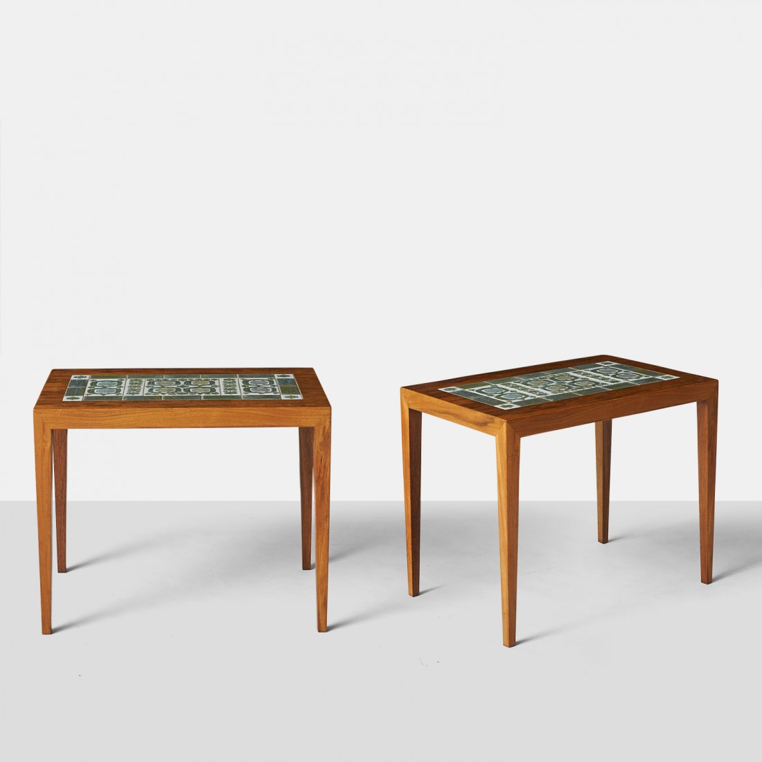 Severin Hansen Jr, Pair of End Tables: A pair of rosewood end tables with inset ceramic tiles on stiletto legs. Severin Hansen Jr for Haslev and tile work by Neils Thorsson.Denmark, c1950sWidth : 22.5" Depth : 14.75" Height : 18.