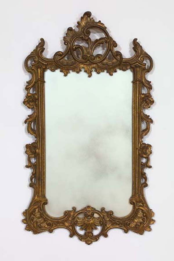 English Carved Giltwood Upright Mirror: English Carved Giltwood Upright Looking Glass, in the 18th-century rococo style of Thomas Johnson (1732-1767), the side rails modeled as narrow columns with attenuated capitals, the cresting a stylize