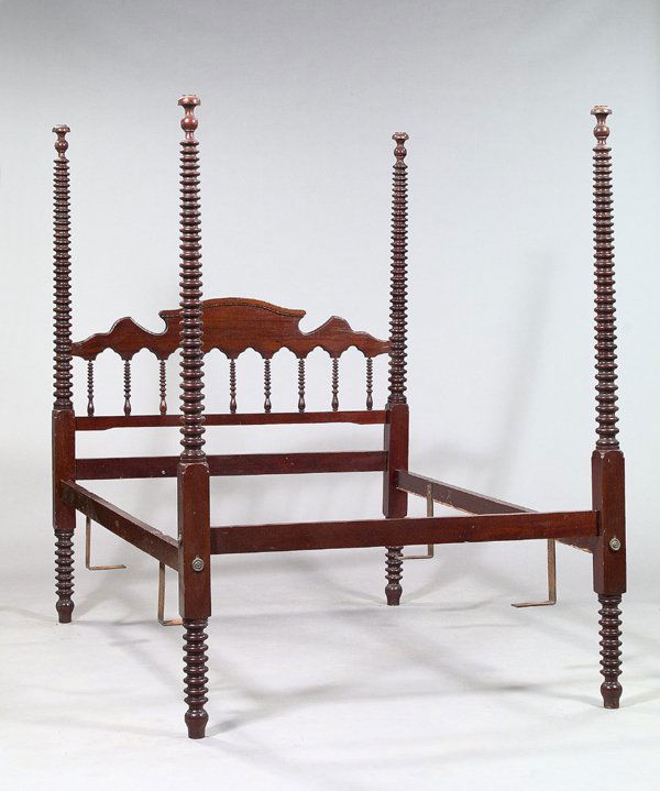 American Elizabethan Spool-turned Walnut Bed: American Elizabethan Spool-turned Walnut Four-Post Bed, c. 1850, each post tapered and spool turned, the headboard wit trefoil silhouettes and spool-turned spindles, h. 82", w. 61", l. 90".