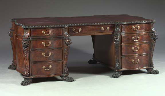 George III-Style Mahogany Partner's Desk,: George III-Style Mahogany Partner's Desk, in the manner of Thomas Chippendale (1718-1779), each pedestal containing four graduated cock-beaded drawers of serpentine form with a brass keyhole escutcheo