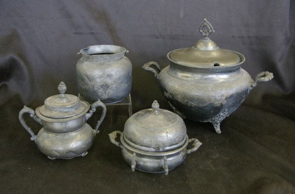 Four-Piece Collection of American Silverplate: Interesting Four-Piece Collection of American Silverplate, consisting of a Manhattan Silver Plate Company covered footed soup tureen in the Aesthetic taste, fourth quarter 19th century, a New Amsterda
