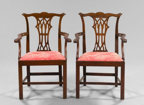 Pair of Georgian Carved Mahogany Open Armchairs: Pair of Georgian Carved Mahogany Open Armchairs, fourth quarter 18th century and later, in the style of Thomas Chippendale, each fitted with a floral rose damask-upholstered slip seat and supported on