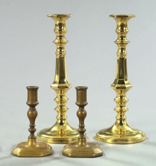 Two Pairs of Brass Candlesticks,: Two Pairs of Brass Candlesticks, consisting of a tall pair of Edwardian brass candlesticks, first quarter 20th century, of substantial weight in the George III style, h. 11", and a diminutive pair of 