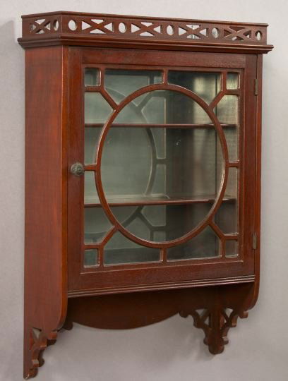 Edwardian Carved Mahogany Hanging Cabinet,: Edwardian Carved Mahogany Hanging Cabinet, first quarter 20th century, in the style of Thomas Chippendale, the interior with a mirrored backplate and a pair of period mahogany shelves, h. 27-1/4", w.