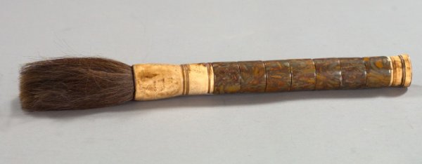 Large Chinese Calligrapher's Brush,: Large Chinese Calligrapher's Brush, in the traditional style, composed of turned and antiqued bone- and polished Hunan marble-mounted badger hair, l. 17".