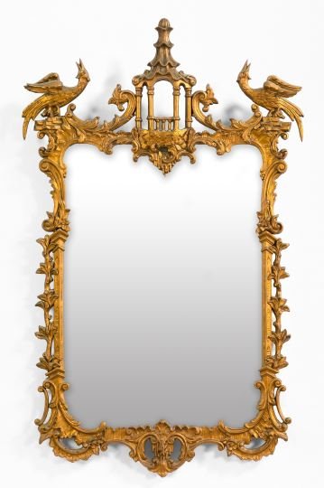 Large and Attractive Carved Giltwood Mirror: Large and Attractive Carved Giltwood Looking Glass, second quarter 20th century, in the chinoiserie style of Thomas Johnson (English, 1714-1778), the crest rail centered with a giltwood stylized pagod