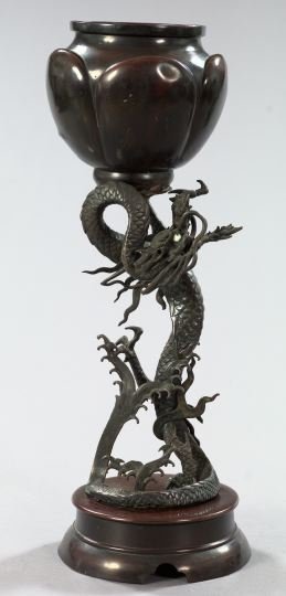Kuang Hsu Patinated Bronze Figural Vase: Attractive Kuang Hsu Patinated Bronze Figural Vase, first quarter 20th century, in the form of a standing Celestial Dragon supporting a lobed circular vessel, the dragon's eyes of opaque white and gre