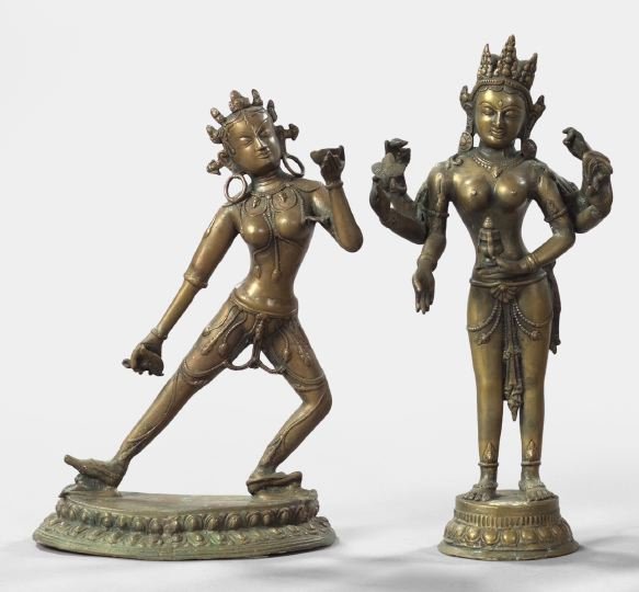 Two Cast-Bronze Figures,: Two Cast-Bronze Figures, consisting of a Nepalese cast-bronze figure of a goddess, 19th century, the partially nude standing figure with six arms, five holding Tantric attributes and one lowered in a 