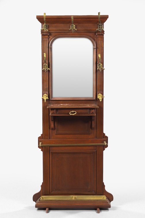 English Brass-Mounted Oak Hall Tree,: English Brass-Mounted Oak Hall Tree, fourth quarter 19th century, the top section with an arched and beveled mirror surrounded by brass coat hooks, a marble shelf and glove drawer below, the base with