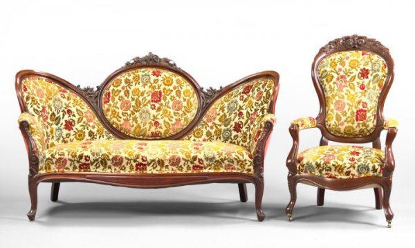 American Rococo Revival-Style Mahogany Settee: American Rococo Revival-Style Mahogany Settee and Similar Armchair, third quarter 20th century, the settee back of tripartite form, with a central medallion and floral-carved crest, wrapping around to