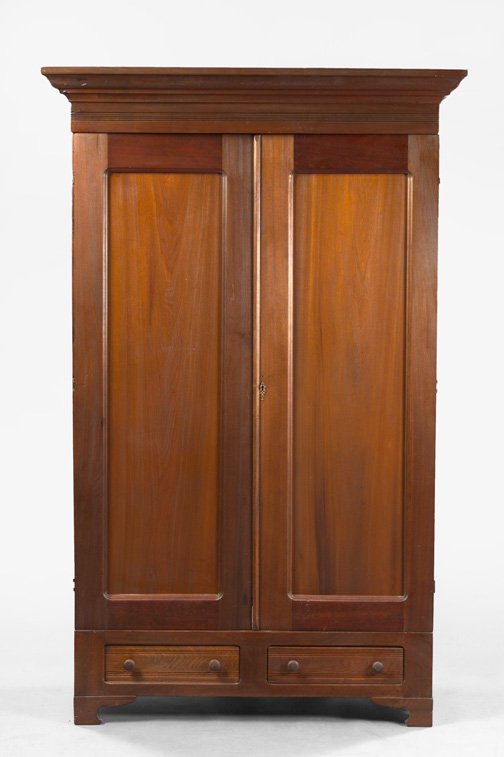 American Renaissance Revival Poplar Armoire,: American Renaissance Revival Poplar Armoire, late 19th century, with a stepped projecting cornice over a pair of paneled doors, the base with a pair of drawers, raised on bracket feet, h. 87-1/2", w. 