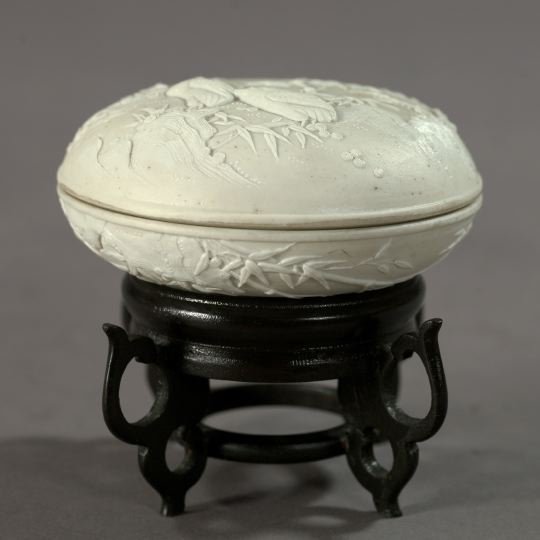 Japanese Edo Blanc-de-Chine Porcelain Box,: Japanese Edo Blanc-de-Chine Porcelain Box, second quarter 19th century, of cushion form, in "Quail" decor, presented on a custom-carved oriental ebonized hardwood quatrepodal stand, h. 4", dia. 4-1/2"