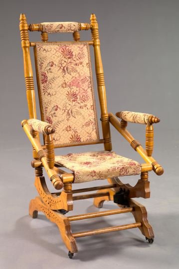 American Eastlake Victorian Maple Platform Rocker: American Eastlake Victorian Rock Maple Platform Rocker, fourth quarter 19th century, the turned frame with a central padded back mounted to a platform base, h. 43-3/4", w. 23-1/4", d. 26".